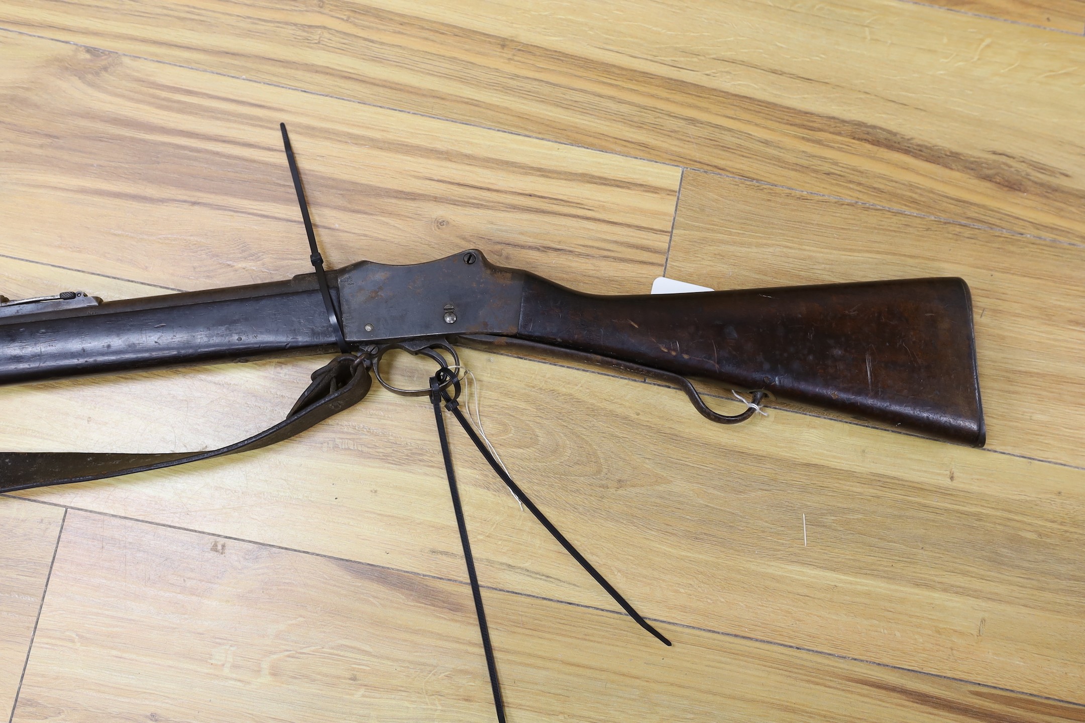 An Enfield breech loading .577 calibre rifle dated 1886, with Wilkinson bayonet and sheath